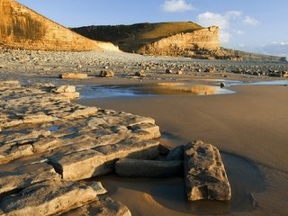 Обои скалы, камни, берег, море, песок, тени, rocks, stones, shore, sea, sand, shadows разрешение 1920x1080 Загрузить
