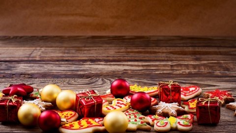 Обои новый год, шары, подарки, рождество, елочные игрушки, печенье, выпечка, деревянная поверхность, new year, balls, gifts, christmas, christmas decorations, cookies, cakes, wooden surface разрешение 2880x1800 Загрузить